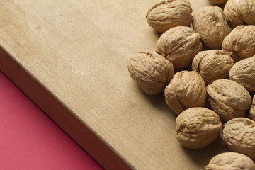 Walnuts on wooden background
