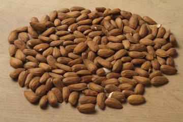 Almonds on wooden background