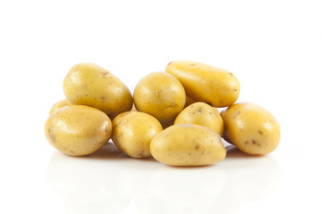 Fresh potatoes on a white background.