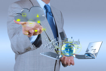 Businessman working with a Cloud Computing diagram on the new co
