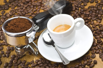 An espresso machine group head with fresh ground coffee