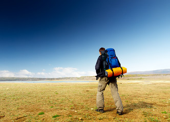 Tourist on the sky background. Sport and active life