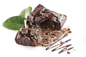 close up of chocolate pieces on white background