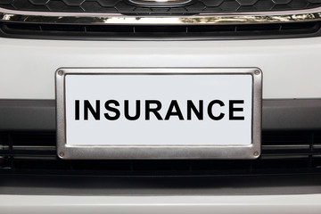 white car  with word insurance in white number plate