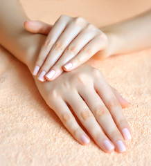 Beautiful woman hands are on a towel