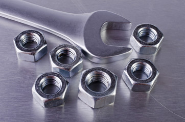 Metal nut and wrench