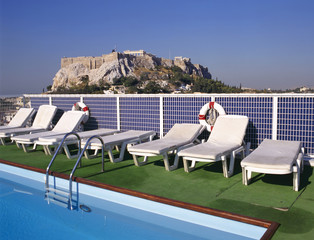 Swimmingpool and at background the Acropolis