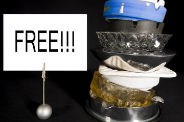 Stack of Ashtrays with 'Free' Sign