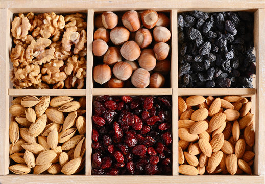 Nuts and dried fruits mix in wooden box