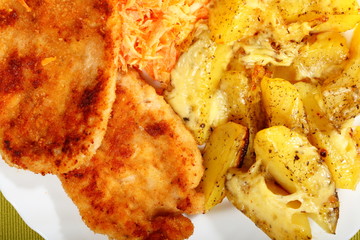 Fried chicken roasted potatos and carrot salad