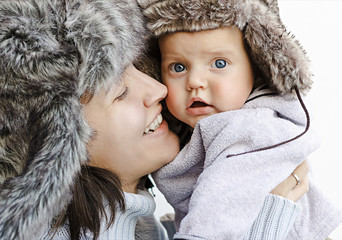 Mom and son in fur hats