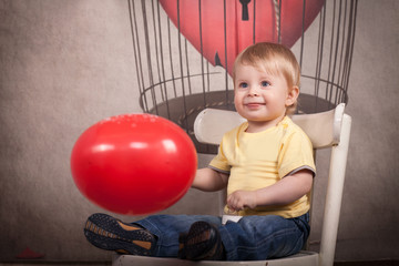 Obraz premium funny lovely baby boy little child in trendy jeans.
