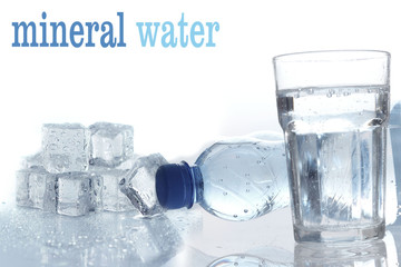 Mineral water in plastic bottle with glass