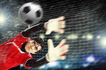 Goalkeeper catches the ball