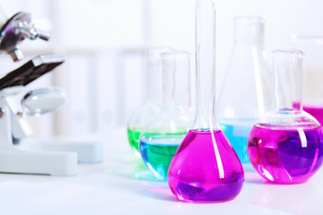 Chemistry laboratory glassware with colour liquids