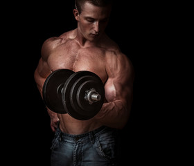 Fototapeta na wymiar Man with a bar weights in hands training. Bodybuilding