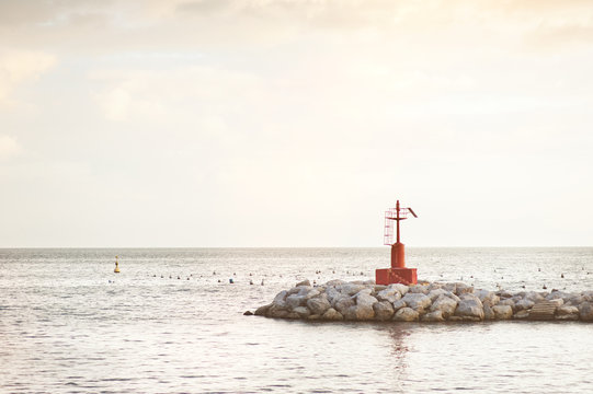 Little Red Lighthouse On The Rocks