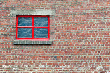 Brick wall with red window