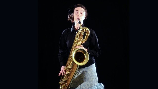 a woman playing the baritone sax