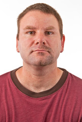 Obraz premium Caucasian male with a half shaven goatee facing forward