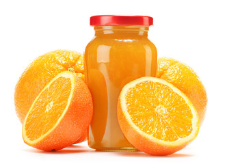 Glass and jug of orange juice, jar of jam and fruits
