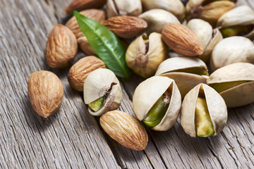 Almonds and pistachios with leaf