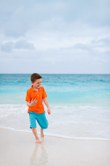 Fototapeta na wymiar Cute boy at beach