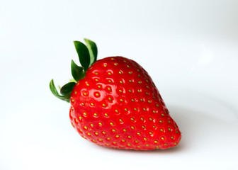 Young man eating a healthy strawberry