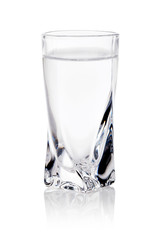 shot glass filled with clear cold alcohol