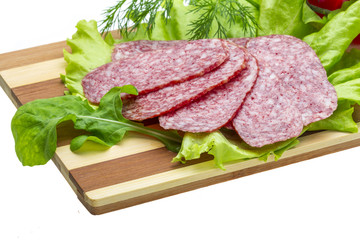 Sausages with salad and basil