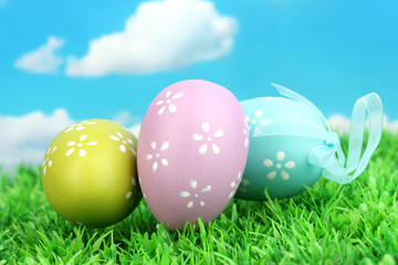 Colorful easter eggs on grass