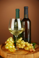 Composition of wine bottles, glass of white wine, grape