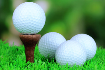 Golf balls on grass outdoor close up