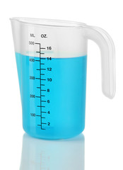 Measuring cup with blue liquid isolated on white