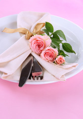 Served plate with napkin and rose close-up