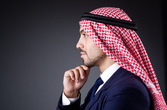 Arab businessman in dark studio