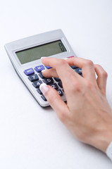 Hands working on the calculator