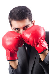 Young businessman with boxing gloves