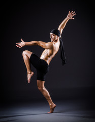 Dancer dancing in the dark studio