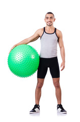 Man with swiss ball doing exercises on white