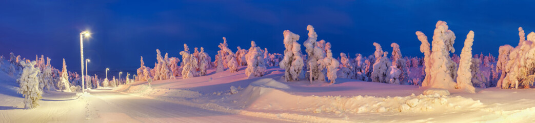 Lighted winter road in Lapland ski resort