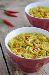 Two bowls with laksa lemak - malaysian noodle soup