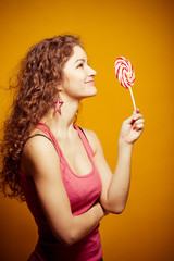 happy young woman with lollipop