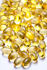 Cod liver oil omega 3 gel capsules isolated on pastel background