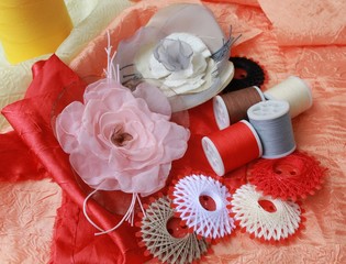 Obraz na płótnie Canvas Closeup picture of threads and decorative handmade flowers
