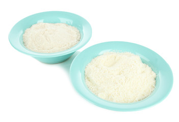 Powdered milk in bowls for baby isolated on white