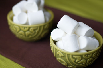 Fototapeta na wymiar Two national oriental bowls with white marshmallows