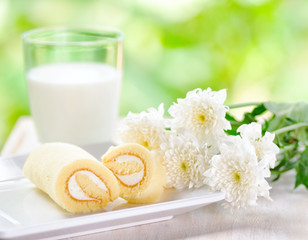 Glass of milk and fresh cake