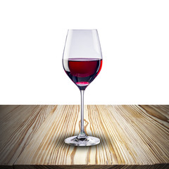 glass of red wine on wood table