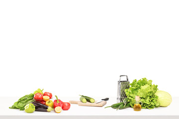 A studio shot of a table full of ingridients for preparing salad © Ljupco Smokovski